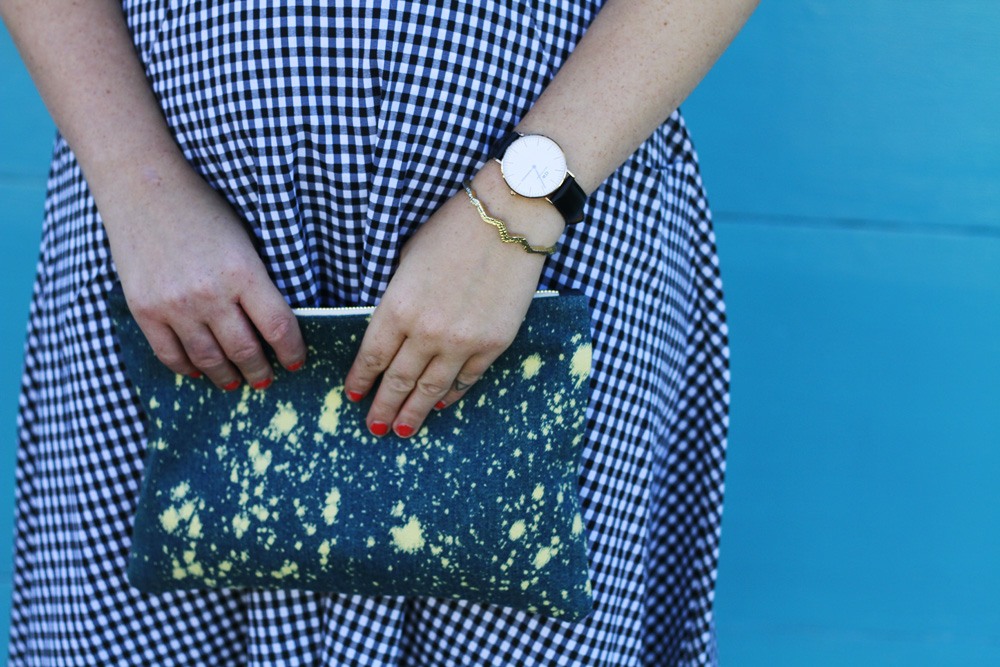 Claire V denim clutch and Daniel Wellington Watch