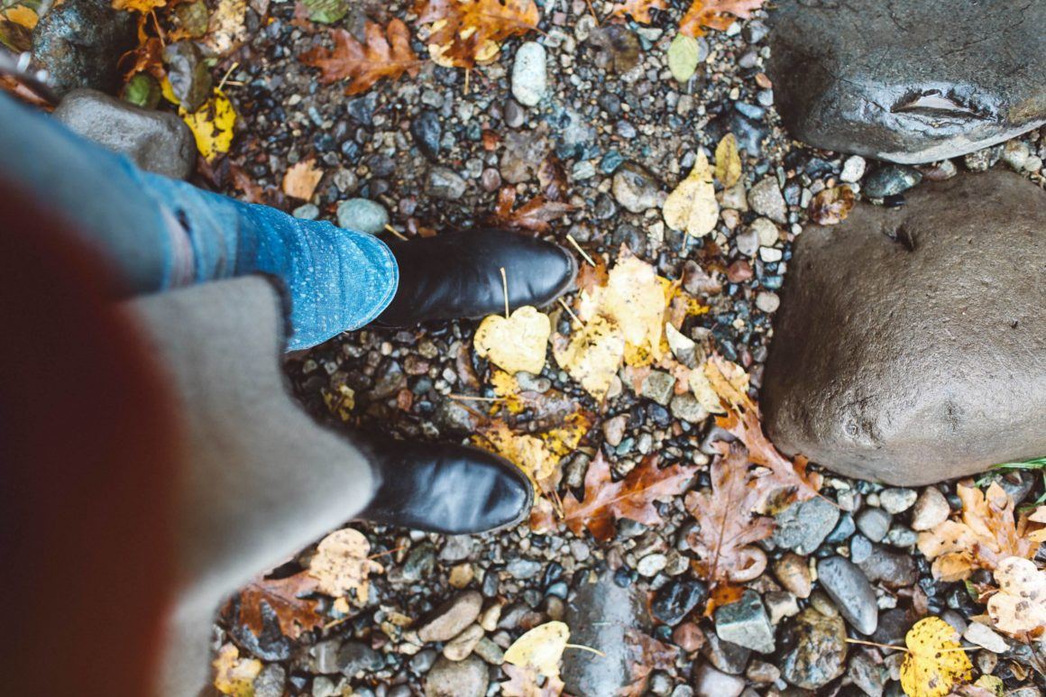 black boots fall leaves