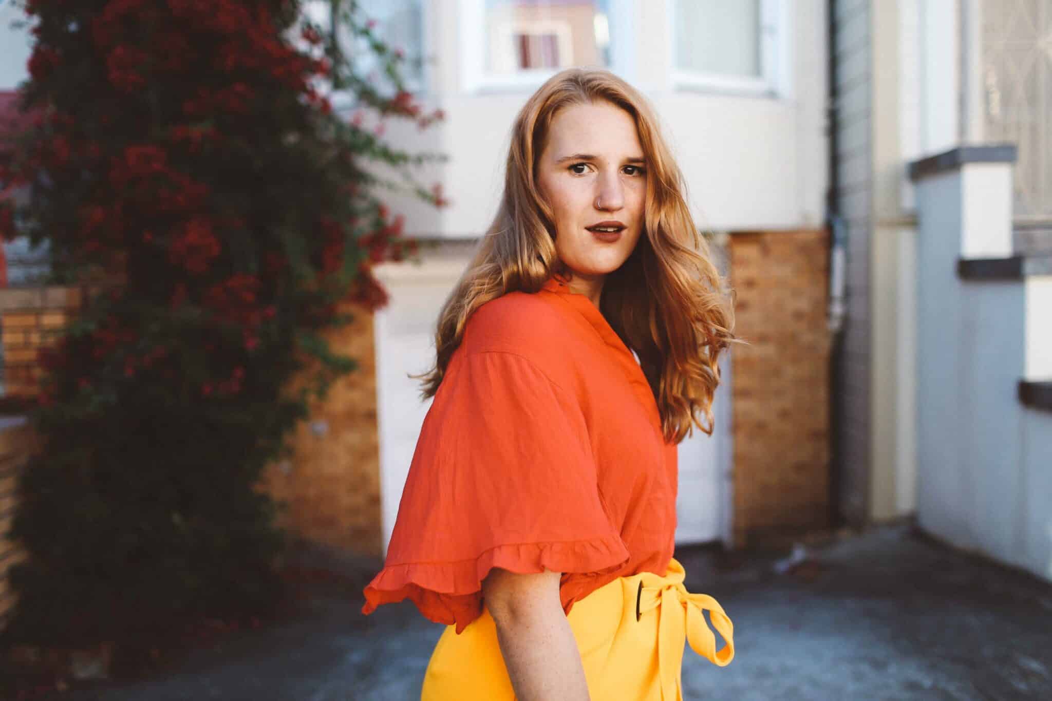 yellow wrap skirt red blouse leopard purse