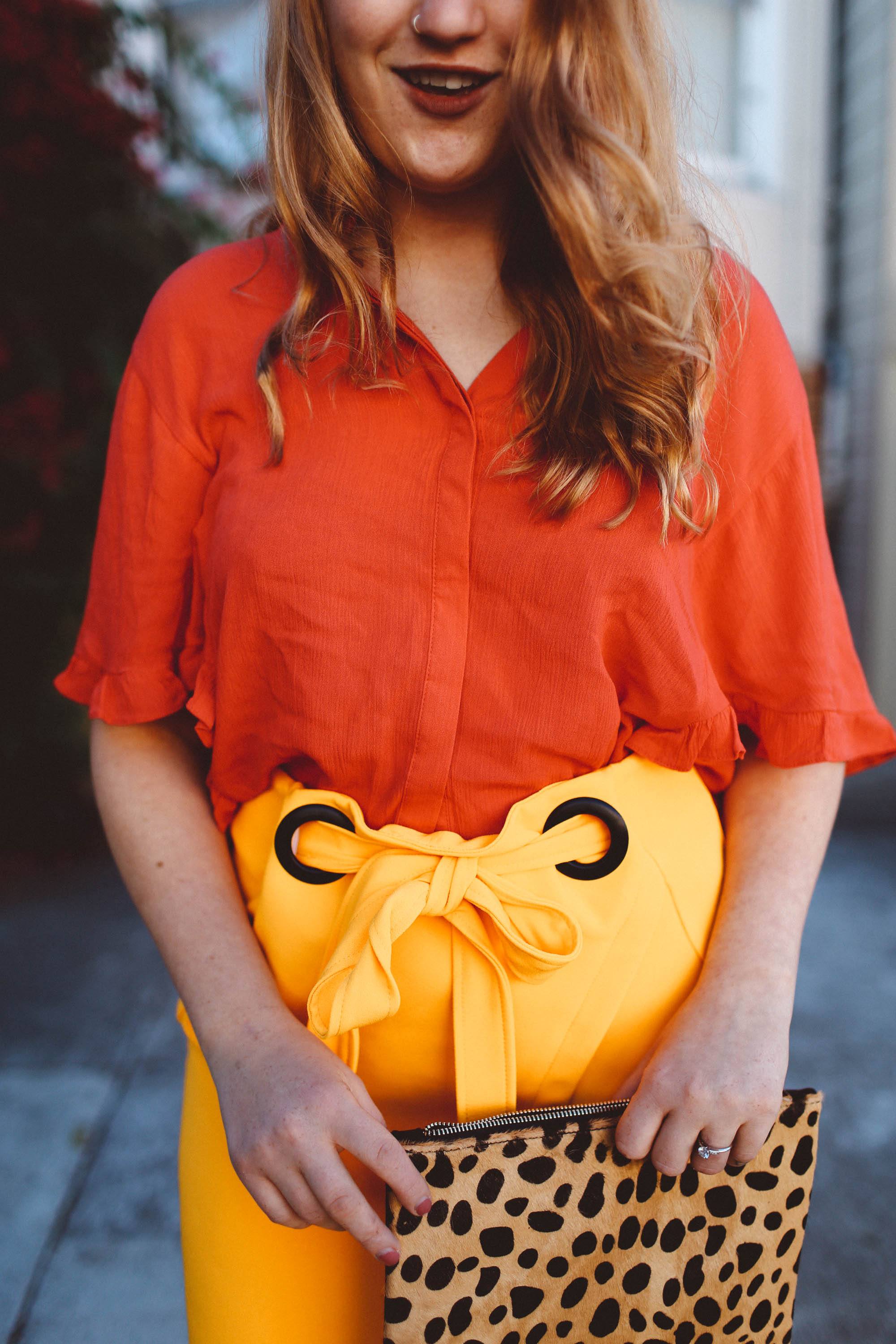 yellow wrap skirt red blouse leopard purse