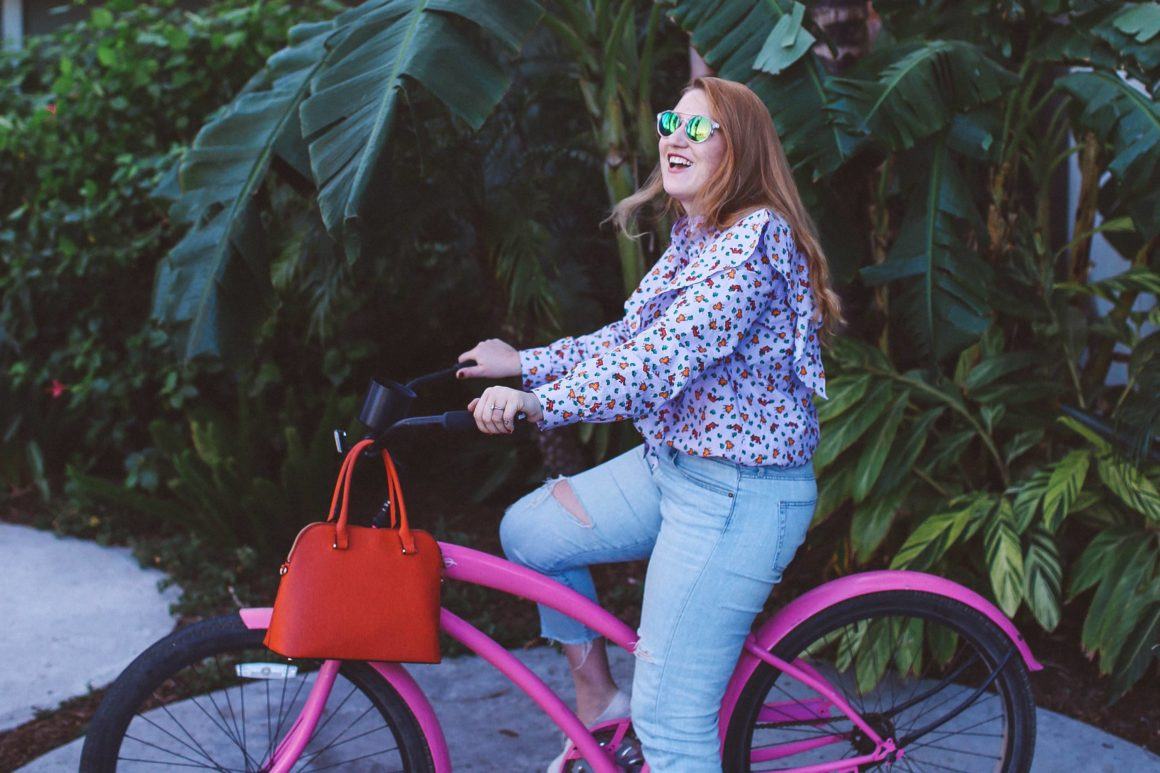 purple ruffle top pink bike palm trees