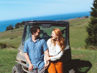 Man and Woman in front of an atv at Newport Ranch in Mendocino