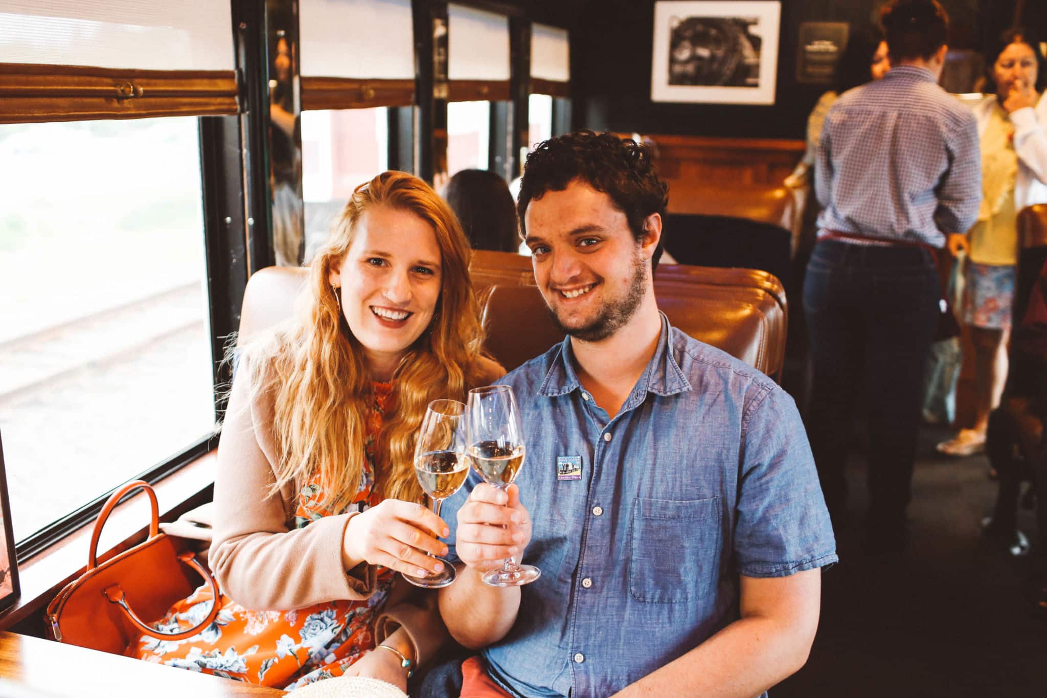 Man and woman clinking Wine Glasses on the Napa Valley Wine Train