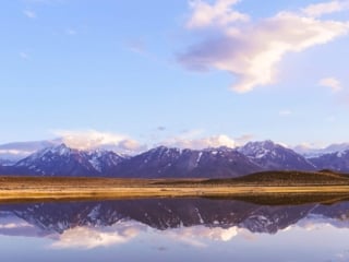 pond and mountains reflecting in the water