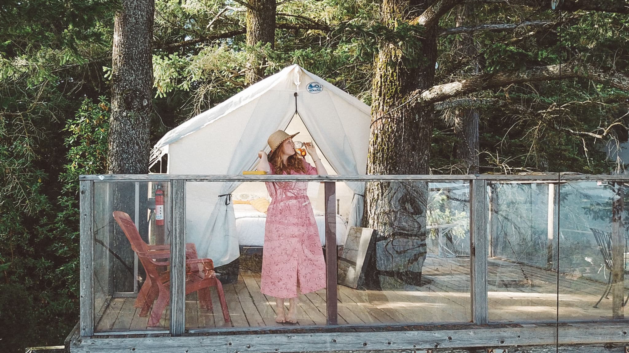 Woman drinking Wine on a treehouse Airbnb