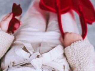 women in red ankle boots
