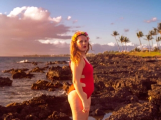 wearing my red swimsuit on Kiwakapu beach in maui