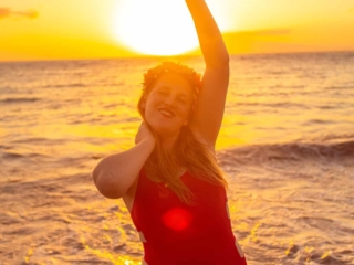 wearing my red swimsuit on Kiwakapu beach in maui