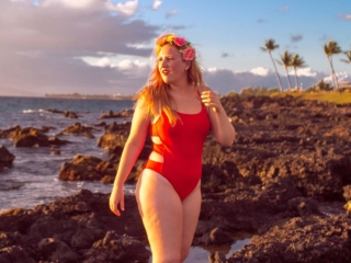 wearing my red swimsuit on Kiwakapu beach in maui
