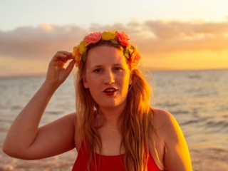 wearing my red swimsuit on Kiwakapu beach in maui