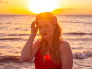 wearing my red swimsuit on Kiwakapu beach in maui