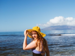 Wearing a one piece swimsuit from Summersalt in the Pacific Ocean