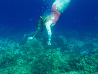 Snorkel Maui Hawaii Cruise - woman snorkeling in coral reef