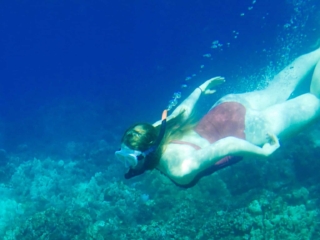 Snorkel Maui Hawaii Cruise - woman snorkeling in coral reef