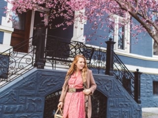 Woman wearing a vintage pink dress perfect for spring