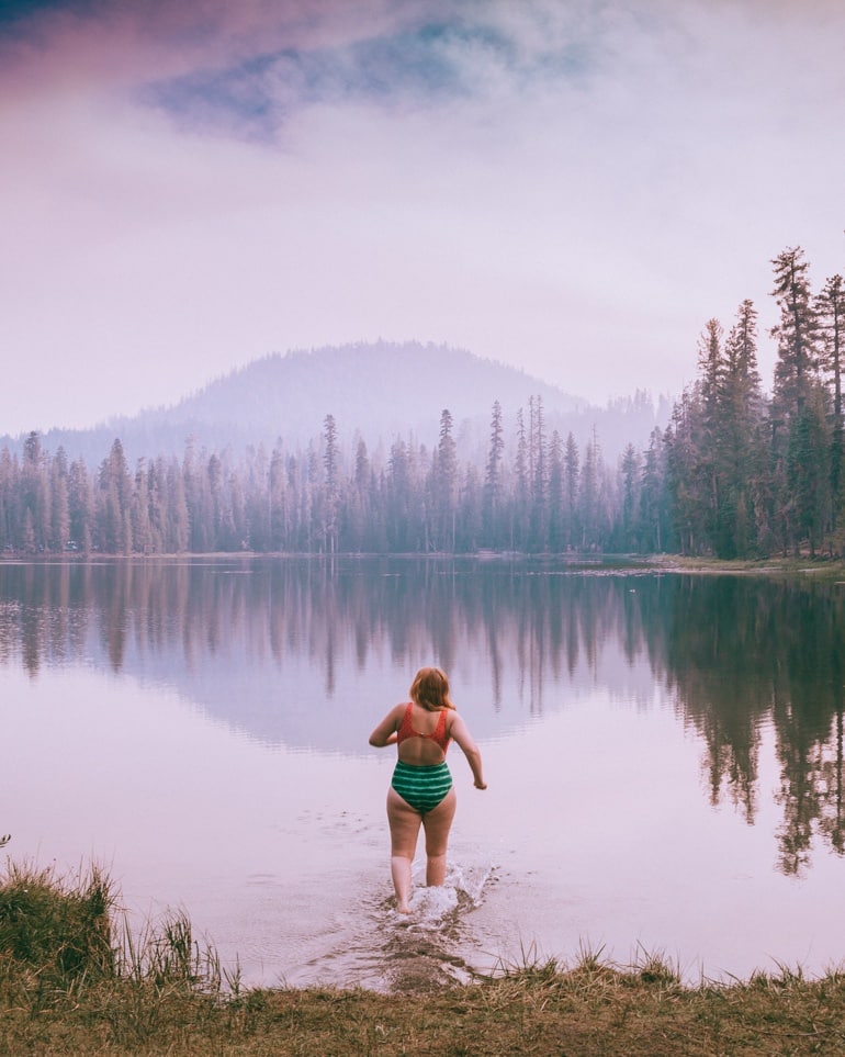 Kara running into Summit Lake in Lassen National Park