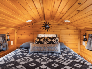 Sedona Airbnb cabin with loft and black and white bedding