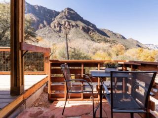 Porch of a Sedona Airbnb cabin overlooking Arizona landscape and Red Rocks