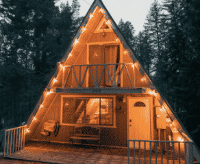 Leavenworth A-Frame cabin Airbnb at night with string lights