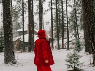 Kara in her red winter coat at the Sleeping Lady Mountain in Leavenworth, Washington